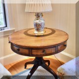 F07. Burton Ching mahogany banded drum table with 4 drawers. 30”h x 36”w 